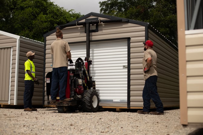 Action Buildings team delivering a shed to its new property