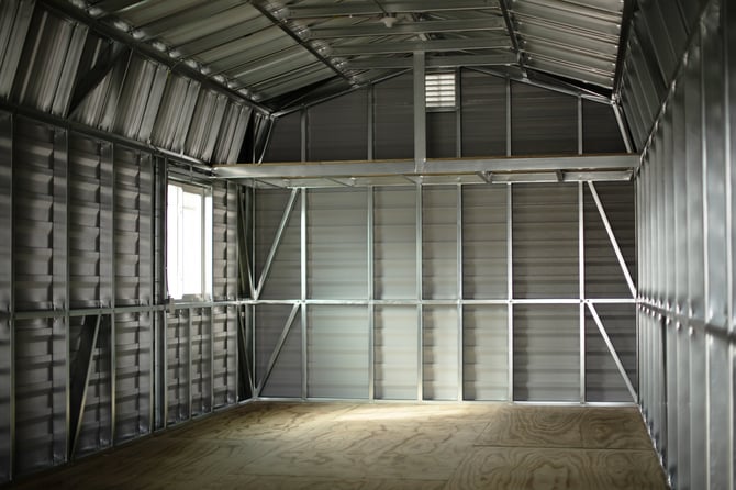 The interior steel framing of an Action Buildings shed